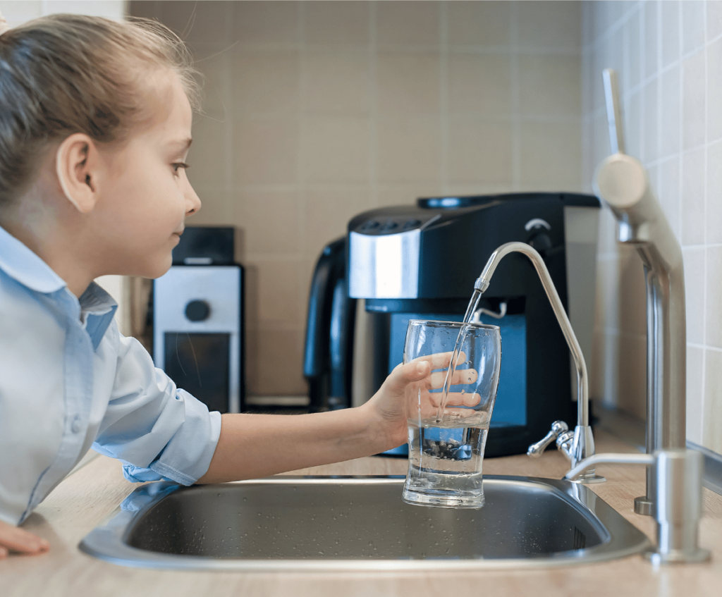 A girl pouring drinking water